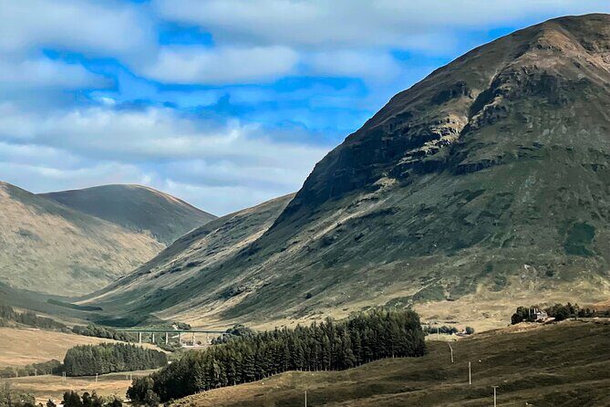Glenfinnan Viaduct Glencoe Fort William Private Tour Glasgow - Commando Monument: WWII memory with Ben Nevis looming